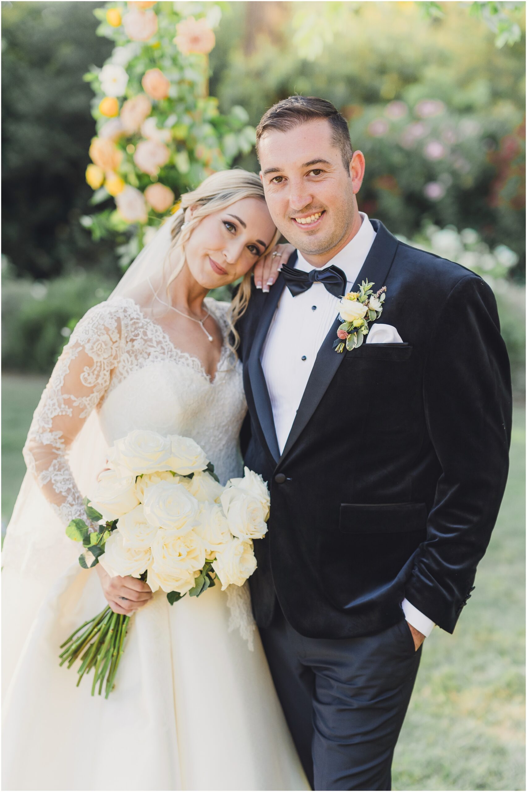 a bride and groom smile in a classic portrait at Malibou Lake
